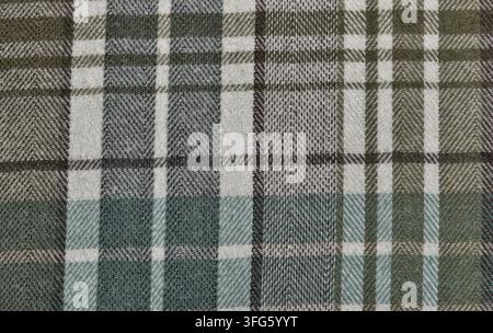 Sfondo a motivo di camicia di flanella a quadri marrone e verde con design di abbigliamento a scacchi. Foto Stock