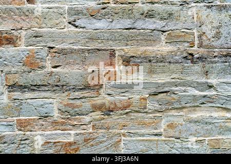 Astratto di un muro in pietra naturale Foto Stock