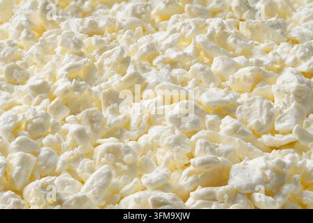 Ricotta fresca in primo piano. Sfondo di ricotta. Foto Stock