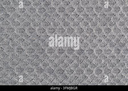 Tessuto a maglia grigio strutturato con sfondo a motivo geometrico all'uncinetto e ripetizione senza cuciture Foto Stock