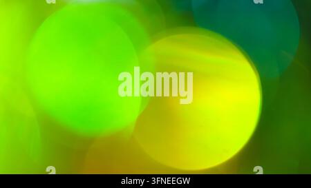 Sfondo sfocato bokeh astratto con morbidi cerchi verde lime e gialli Foto Stock