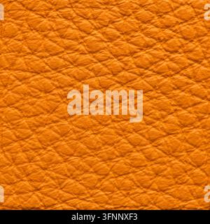 Macro dettagliata di una superficie in pelle di un ricco e brillante arancione con una distinta texture granosa a ciottoli e un motivo tattile smussato con una morbida dimensione Foto Stock