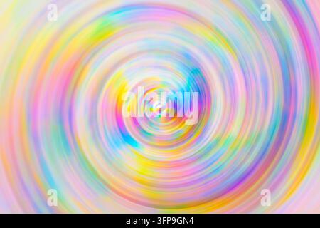 Spirale multicolore morbida con sfocatura circolare del movimento che crea uno sfondo sognante e vibrante Foto Stock