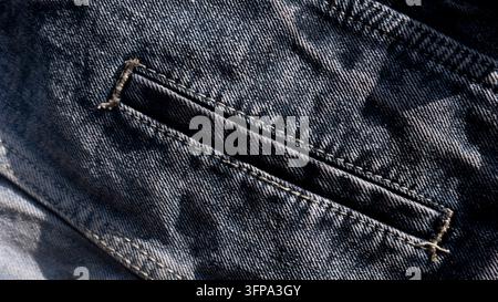 Primo piano della cucitura della tasca in denim texture di stoffa sfondo Foto Stock