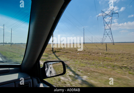 view from inside car of power transmission lines in Florida USA Foto Stock