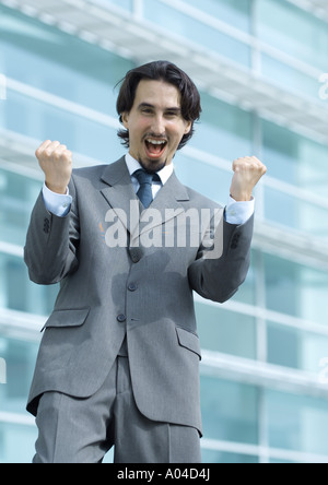 Business man gridando e facendo a suon di pugni Foto Stock