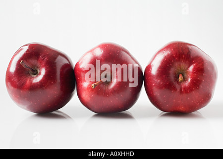 Tre mele rosse Foto Stock