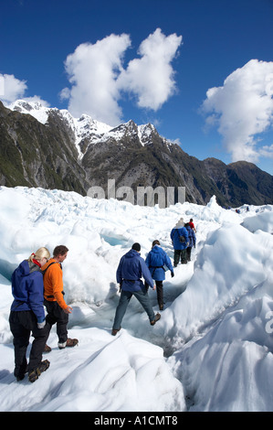 Heli escursionisti Ghiacciaio Franz Josef costa ovest di Isola del Sud della Nuova Zelanda Foto Stock