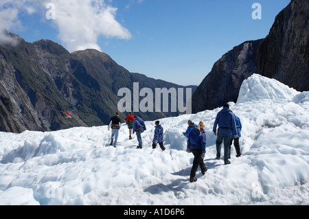 Heli escursionisti Ghiacciaio Franz Josef costa ovest di Isola del Sud della Nuova Zelanda Foto Stock