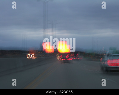 Edifici sembra essere sul fuoco a causa di impostazione di riflesso della luce del sole e le luci di ballo Foto Stock