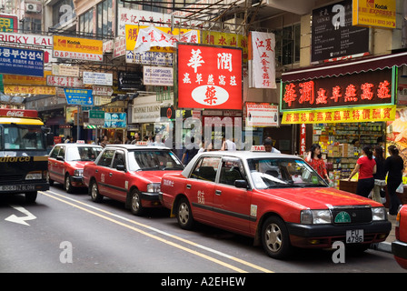 Dh Tsim Sha Tsui Hong Kong Linea Rossa di taxi di Haiphong strada strada taxicabs cabine strade taxi Foto Stock