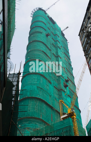 Dh Tsim Sha Tsui Hong Kong nuovo edificio prestigioso Shopping Arcades con bambù ponteggi Foto Stock