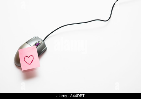Cuore nota sul mouse del computer Foto Stock