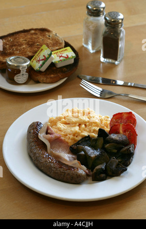Cuocere la completa prima colazione inglese Foto Stock
