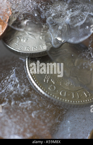 Monete congelate in ghiaccio Foto Stock