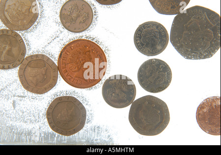 Congelati sterlina monete Foto Stock