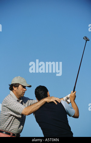 Golf istruttore client di posizionamento Foto Stock