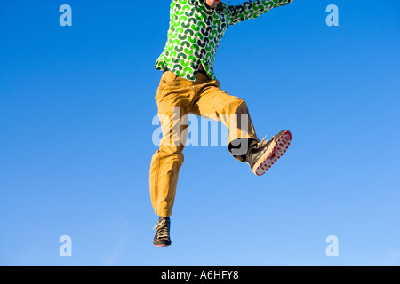 young man caught in mid leap Foto Stock
