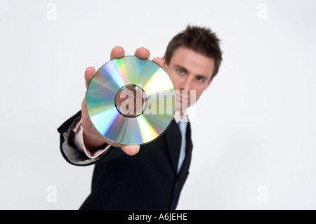 Imprenditore tenendo un cd rom dvd Foto Stock