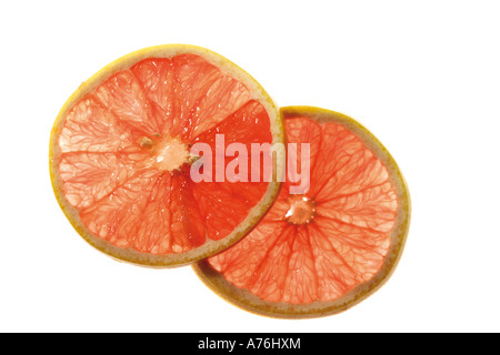 Due fette di pompelmo rosso rubino Foto Stock