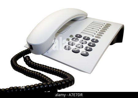 Telefono ufficio con cavo sinuose isolato su bianco. Foto Stock