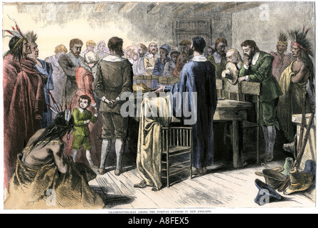 La Giornata del ringraziamento festa tra il Puritans e nativi americani del New England 1620 s. Colorate a mano la xilografia Foto Stock