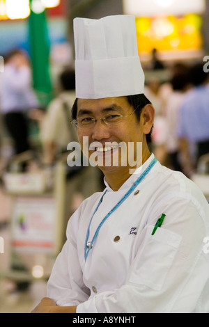 Lo Chef cinesi in uniforme e gli Chef Hat Hong Kong Cina Foto Stock