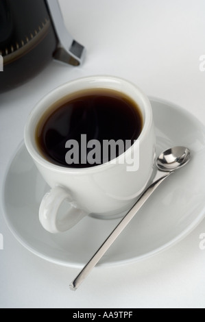 Il caffè nella tazza e piattino Foto Stock