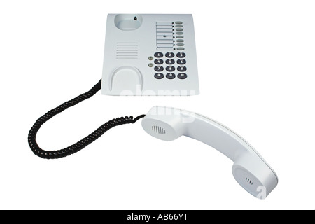 Telefono ufficio con cavo sinuose isolato su bianco. Foto Stock