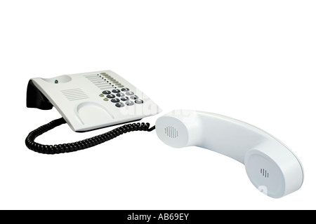 Telefono ufficio con cavo sinuose isolato su bianco. Foto Stock