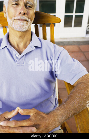 Uomo seduto Foto Stock