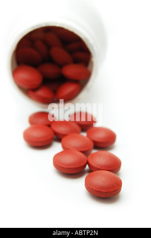 Pillole di rosso la fuoriuscita della bottiglia Foto Stock
