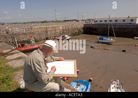 Il Galles Glamorgan Porthcawl uomo pittura vecchio porto esterno in acquerelli Foto Stock