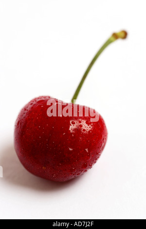 Una ciliegia di colore rosso da vicino Foto Stock