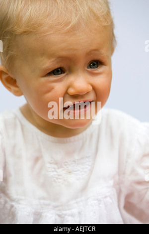 Ritratto di un 10 mesi Baby girl Foto Stock