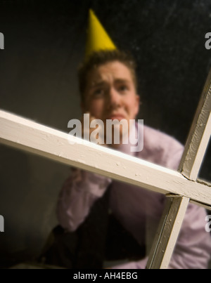 Triste uomo in party hat Foto Stock