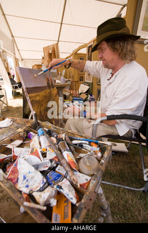 Regno Unito Hampshire Romsey Broadlands CLA Game Fair artista Nick Cawston al lavoro Foto Stock