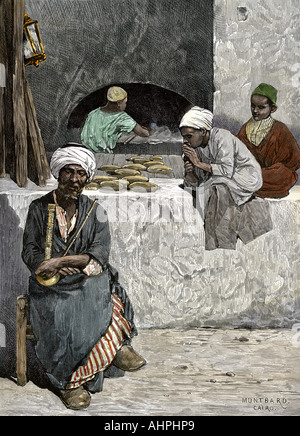 Panettieri arabi al loro forno del pane in Il Cairo Egitto 1880. Colorate a mano la xilografia Foto Stock