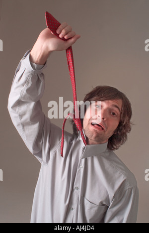 L'uomo infelice con il lavoro di ufficio Foto Stock