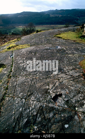 Cup-e-ring contrassegnato le rocce in Achnabreck Foto Stock