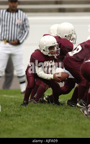 La gioventù biddy football americano in azione Foto Stock