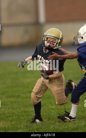 La gioventù biddy football americano in azione Foto Stock