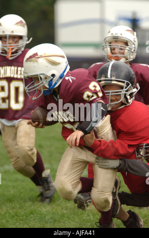 La gioventù biddy football americano in azione Foto Stock