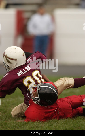 La gioventù biddy football americano in azione Foto Stock