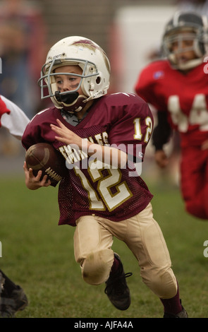 La gioventù biddy football americano in azione Foto Stock