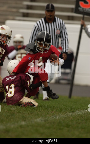 La gioventù biddy football americano in azione Foto Stock