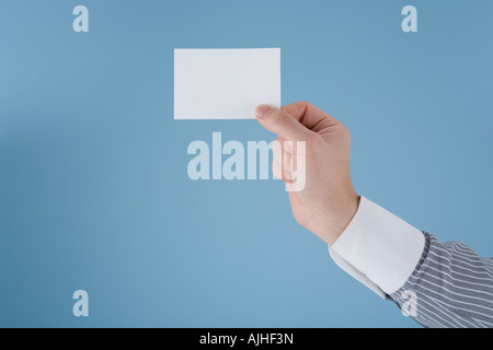 Mano tenendo la scheda Foto Stock