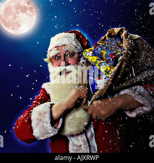 Babbo Natale con un sacco di regali Foto Stock