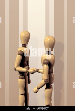 Bambole snodate agitando mani Gliederpuppen beim Handshake Foto Stock