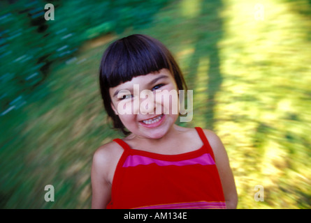 Ragazza la filatura a papà s lap Foto Stock